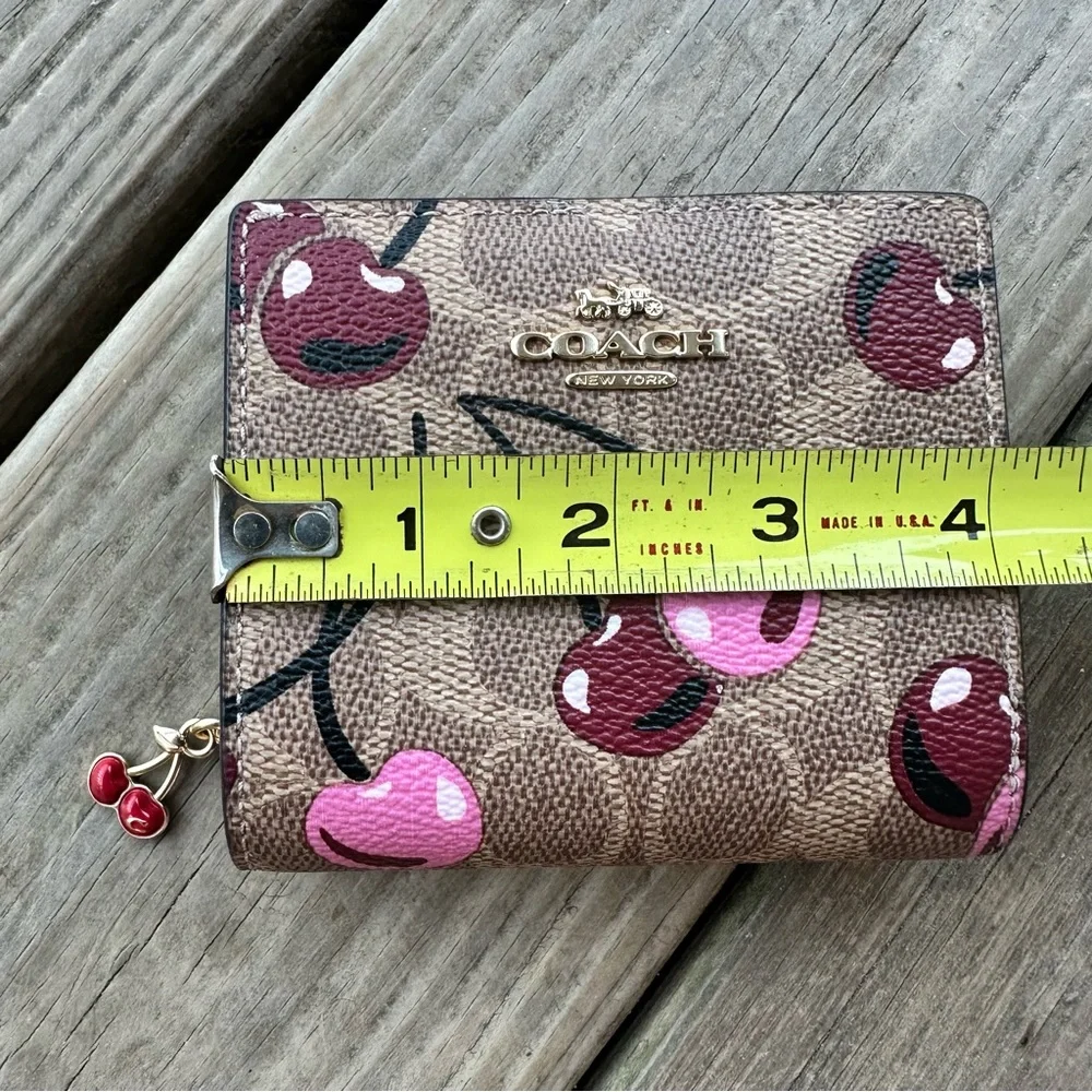 Coach Snap Wallet In Signature Canvas With Cherry Print In Tan Multi Zip Fold